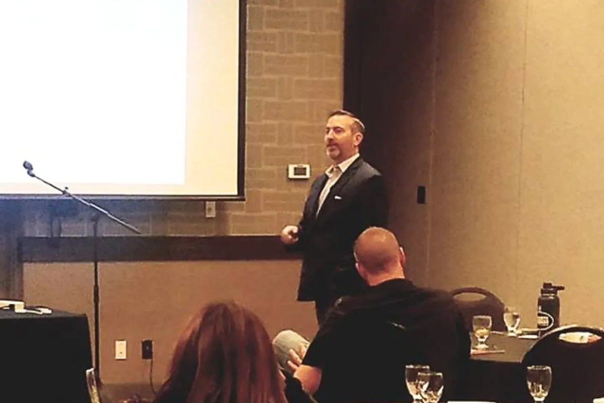 Chris Hallberg presenting military leadership insights at a workshop